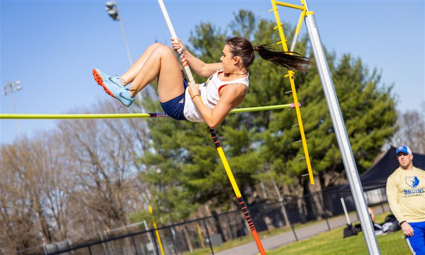 A student pole vaults